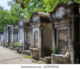 A row of weathered tombs in New Orleans' Lafayette Cemetary