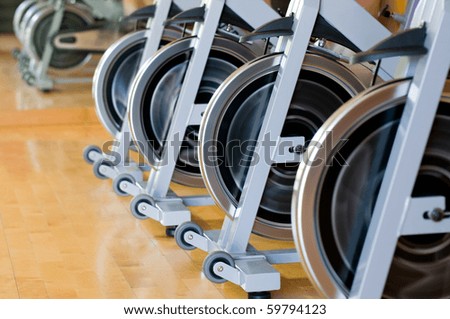 Similar – Image, Stock Photo A row of bicycles, behind them greenhouses, behind them the typical narrow buildings of downtown Amsterdam