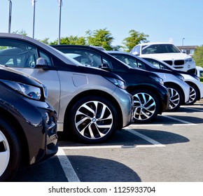 Row Of Wheels On Electric Cars On Garage Forecourt. Edinburgh Peter Vardy Garage, Scotland UK. JULY 2018