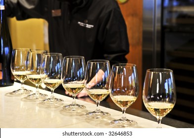 Row Of White Wine Glasses In Winery Tasting Event