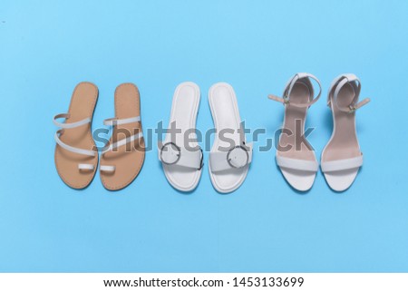Row of woman three pair shoes isolated on a blue background
