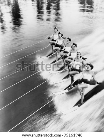 Row of women water skiing