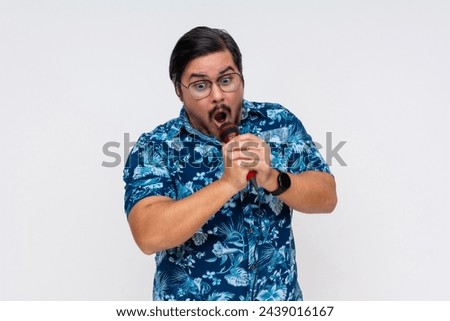 A rowdy and possibly drunk middle aged tourist hollering into the microphone during a fun karaoke night.