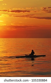 Rower at sunset