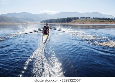 Rowing crew rowing scull on lake - Shutterstock ID 2328322507