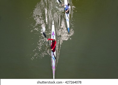 Rowing Race Between Man And Woman. Gender Equality