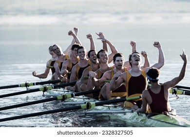 Rowing team celebrating in scull on lake - Shutterstock ID 2328327505