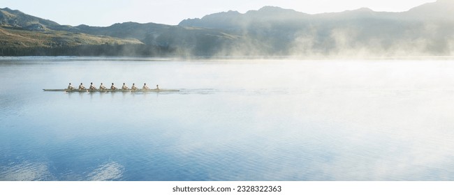 Rowing team rowing scull on lake - Powered by Shutterstock