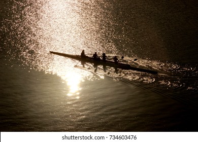 Rowing Team Working Out On A Sunrise
