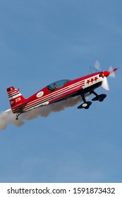 Rowland Flat, Australia - April 14, 2013:  Aerobatic pilot Paul Andronicou flying a single engine Extra 300S aerobatic aircraft VH-XTR. 