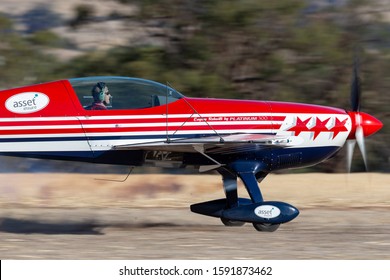 Rowland Flat, Australia - April 14, 2013:  Aerobatic pilot Paul Andronicou flying a single engine Extra 300S aerobatic aircraft VH-XTR. 