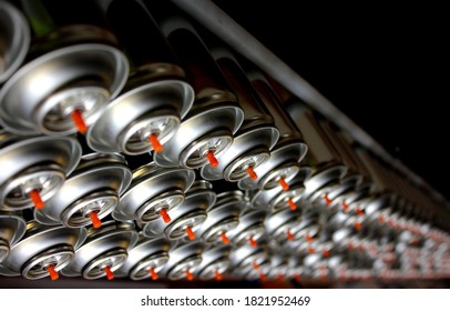 Rows Of Aerosol Cans On Factory Belt