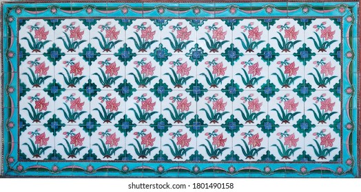 Rows of antique Nyonya Tiles with red tulips. Vintage wall tile in penang.
