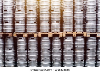 Rows of beer kegs. Large warehouse of beer kegs	
