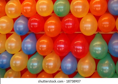 Rows Of Brightly Colored Balloons In A Midway Game At A County Fair