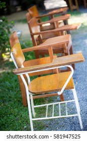 rows of a chairs. empty Steel Lecture chair with wood seat table squab with clipping path. The outing education concept.