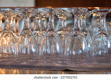 Rows Of Clean Empty Beer Glasses Turn Upside Down On Counter Bar