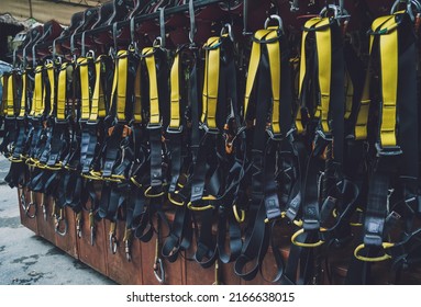 Rows of climbing safety ropes and carabiners and helmets - Shutterstock ID 2166638015