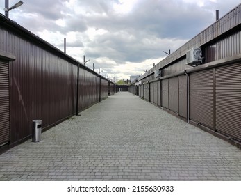 Rows of closed shutters of security shops and kiosks in the future. Without people