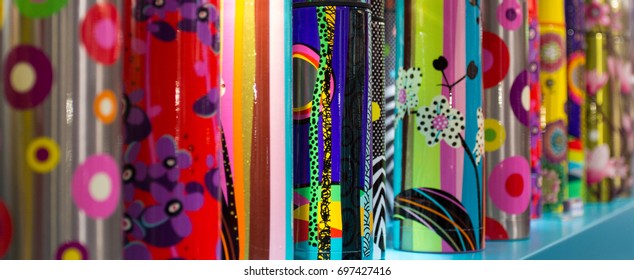 Rows of colorful multitextured objects with small focus zone and nice bokeh