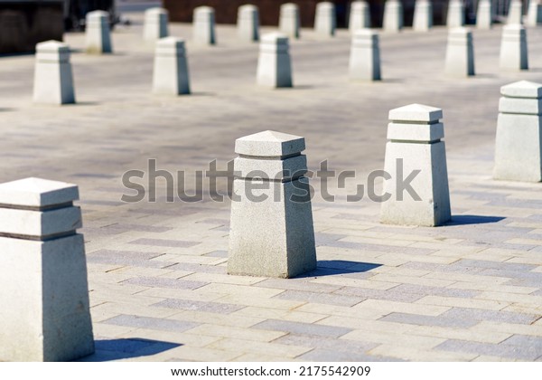 Rows of\
concrete posts to separate the flow of\
cars