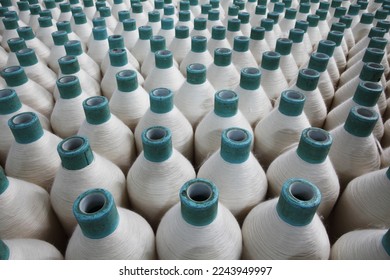 Rows of cotton thread spools in Textile Spinning unit