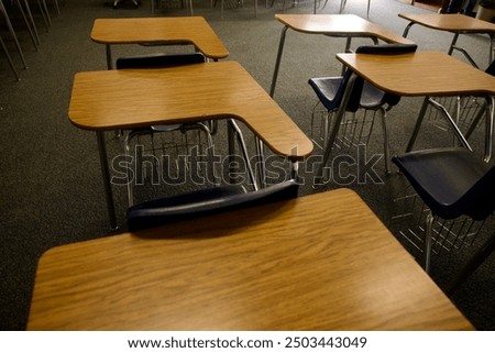 Rows of desks inside a classroom