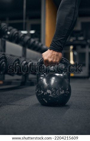 Similar – Image, Stock Photo man taking a weight plate in a gym