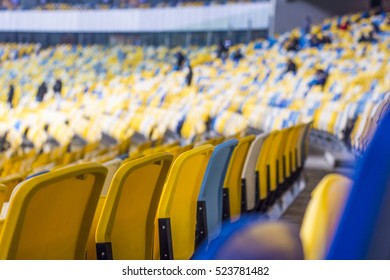 Rows of empty blue seats with the numbers