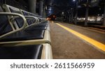 rows of empty chairs at a train station