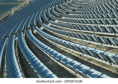 Rows of empty stadium seats during COVID-19 pandemic.