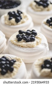 Rows Of Fresh Mini Pavlova Meringue Nests Filled With Mascarpone Cheese