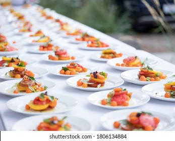Rows of fruit salad at dinner party catering event