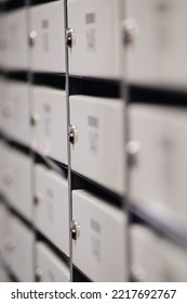 Rows Of Mailboxes In The Lobby Of An Apartment Building, A Lot Of Mailboxes With Apartment Numbers