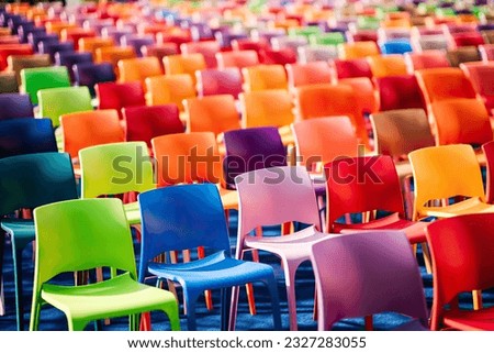 Rows with many colorful, plastic chairs and armchairs.