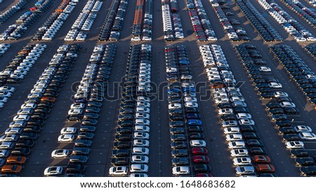 
Rows of new cars in the parking lot.
Aerial photography.
