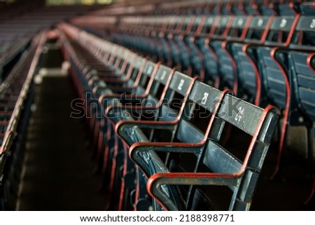 Rows of old wooden baseball stadium seats