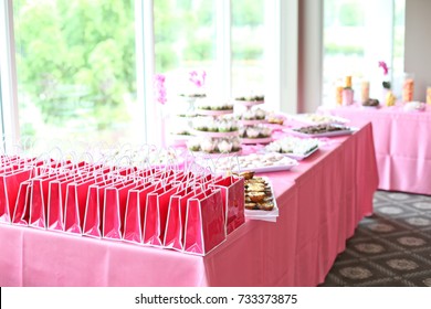 Rows Of Pink Party Favor Bags For Guests Attending A Bridal Shower Celebration 