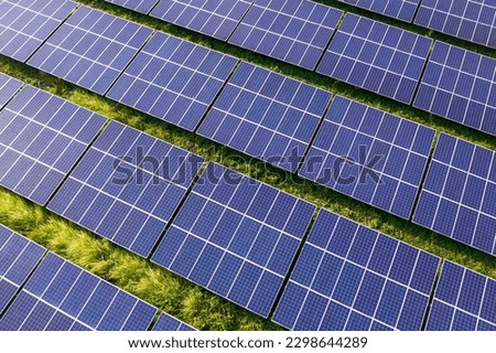 Rows of polycrystalline solar panels. Former farmland or agricultural areas in the countryside used as a solar farm.