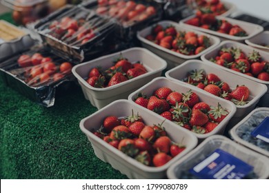 Rows Of Punnets With Fresh Strawberries On Sale At A Local Market In The Cotswolds, UK. 