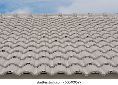 Rows Of Roof Tiles On The Top Of House With Sky Background.