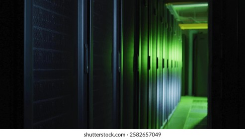 Rows of servers in data center glowing with green ambient light. Technology, network, infrastructure, cybersecurity, digital, server room - Powered by Shutterstock - Get 15% off with code: PIKWIZARD15