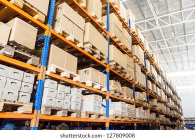 Rows of shelves with boxes in factory warehouse