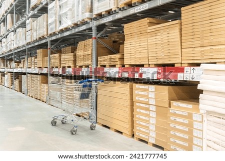 Rows of shelves with boxes in Ikea store in Moscow