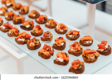 Rows Of Small Delicious Canapes On A Tray. Gourmet Food, Perfect Appetizers Provided By Catering Company.