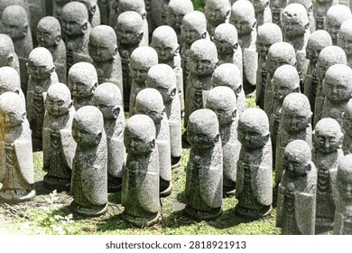 Rows of Small Stone Jizo Statues at a Japanese Temple