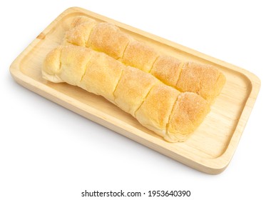 Rows of Soft Buttered Bread topping with sugar served on wooden tray isolated on white background. Clipping path.