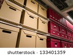 Rows of stacked storage boxes stacked on shelves