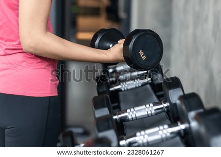 Rows of stainless dumbbell in the gym, Sports dumbbells in modern sports club.