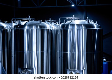 Rows of steel tanks for beer fermentation and maturation in a craft brewery